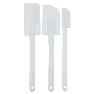 Three white spatulas are arranged vertically on a white background.