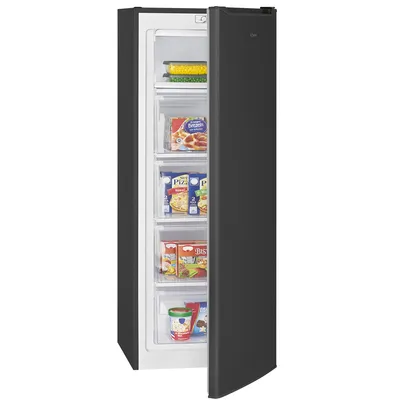 An open black freezer with drawers full of frozen food.