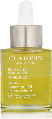 A bottle of Clarins Aroma Santal Treatment Oil.