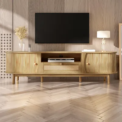 A modern living room with a TV stand and a mounted TV.