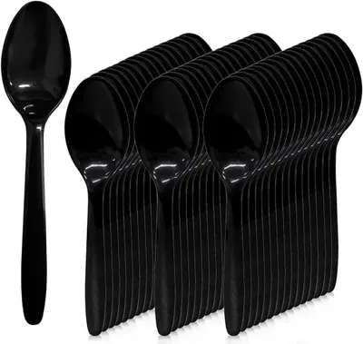 A group of black plastic spoons are neatly arranged.