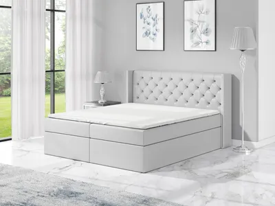 Produktbild von Boxspringbett BARO 120x200 mit 2 Bettkästen, Bonell-Matratze und Topper. Dekorative Stifte an den Seiten der Kopfstütze. Bett Komplett-Set mit Matratze,Bettkasten & Kopfteil. Stoff Eko Cayenne. Elegantes Bett mit massives Kopfteil.