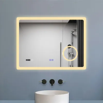 A modern bathroom vanity with a sink and a lighted mirror.