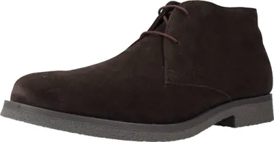 A single brown suede chukka boot is shown against a white background.
