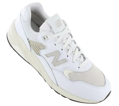 A white New Balance sneaker is shown against a white background.