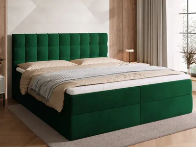 A green upholstered bed with a tufted headboard, shown in a bedroom setting.