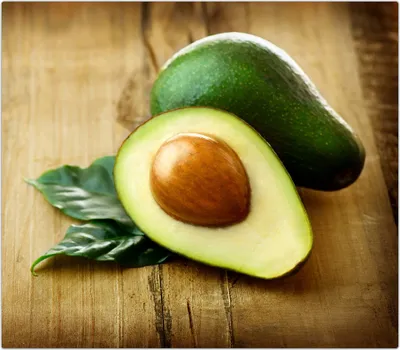 Produktbild von Spritzschutz Herdabdeckplatte Schneidebrett aus Glas Avocado aufgeschnitten 1-Teilig (60x52cm)
