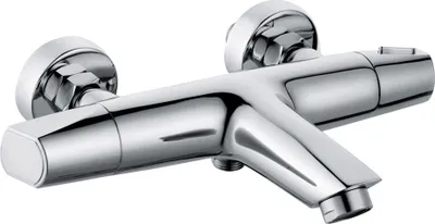 A chrome-finished bathtub faucet with two knobs, mounted on a wall.