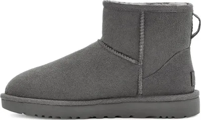 A side view of a single gray UGG boot.
