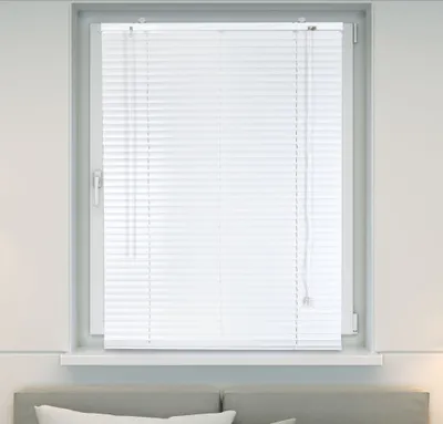 A white aluminum venetian blind is shown covering a window.