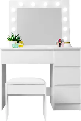 A white vanity table with a mirror and lights, and a white stool.