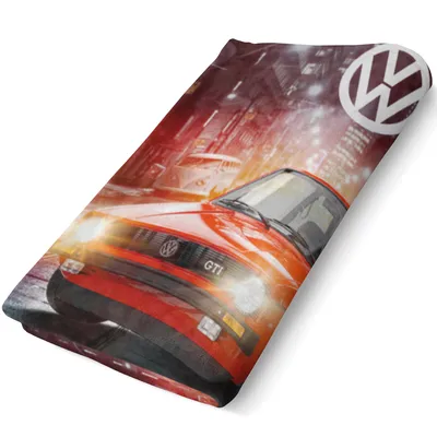 A red Volkswagen Golf GTI car is depicted on a blanket, with a city background and the Volkswagen logo.