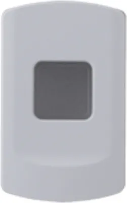 A close-up of a white device with a gray button.