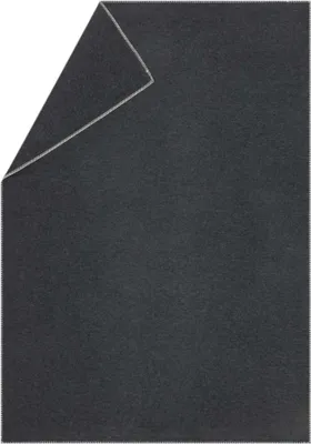 A dark gray blanket folded in a corner.