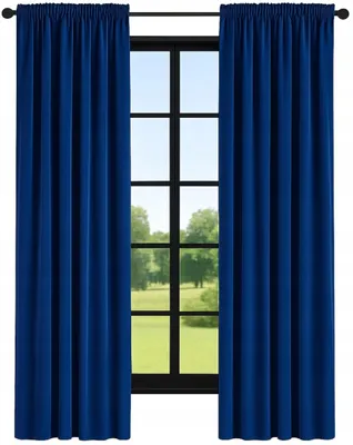 A pair of navy blue curtains hanging in front of a window with a view of a grassy field and trees.