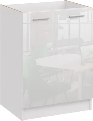 A white kitchen base cabinet with two doors and silver handles, shown in a studio setting with a blurred background of an office or dining area.