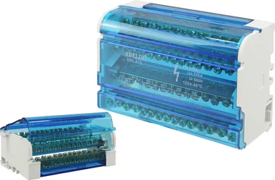 Two electrical distribution blocks with transparent blue covers are shown against a white background. One is larger and positioned to the right, while a smaller one is to the left.