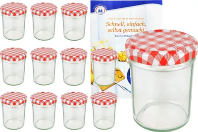 A set of twelve glass jars with red and white checkered lids, alongside a recipe book.