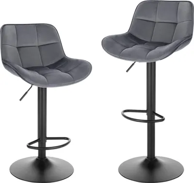 Two dark gray velvet bar stools with black metal bases and adjustable height mechanisms are shown against a white background.