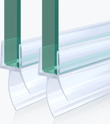 Two pieces of clear plastic shower door seals attached to green glass.