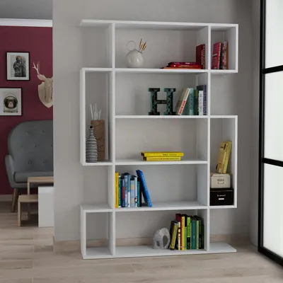 A modern white bookshelf filled with decorative items and books, placed in a room setting.