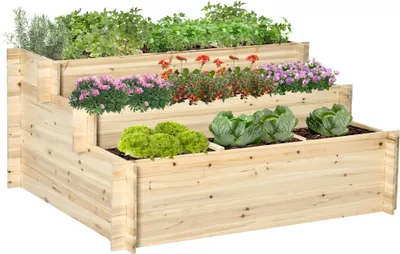 A tiered wooden planter box filled with various plants, including herbs, flowers, and vegetables.