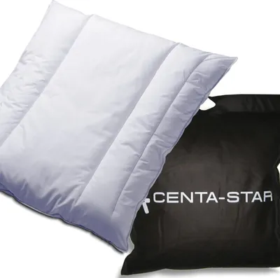A white pillow and a black storage bag with the brand name on it.