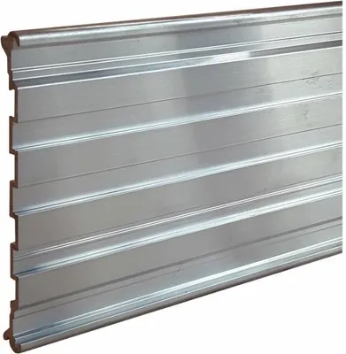 A close-up, straight-on view of a silver-colored metal edging strip with horizontal ridges.