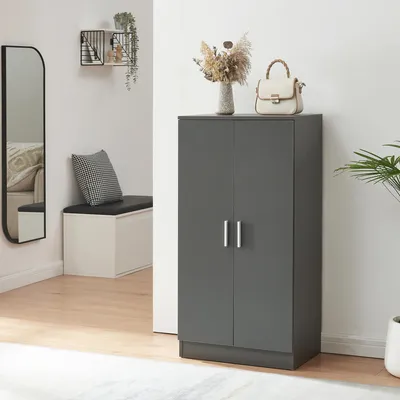 A hallway with a shoe cabinet, mirror, and bench.