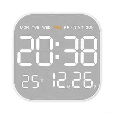 A digital clock displaying time, date, temperature, and day of the week.
