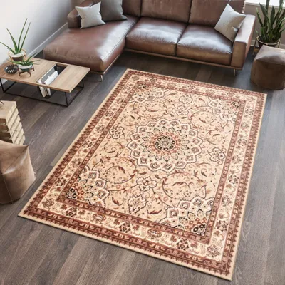 A living room scene with a sectional sofa, coffee table, and a large area rug.