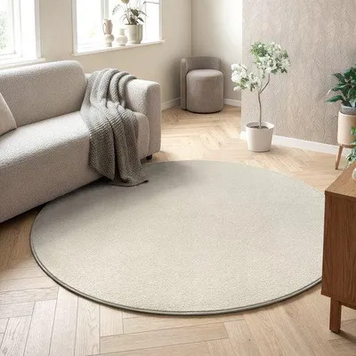 Productafbeelding van Unyqoos® Vloerkleed van rundervacht, 150 cm diameter – Effen crème kleur, laagpolig, polypropyleen, 1850 g/m², modern design, geschikt voor woonkamer en slaapkamer