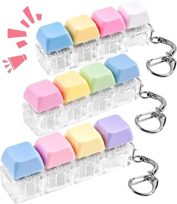 Imagen del producto de Juguete antiestrés con forma de teclado: set de 3 unidades. Mini llavero con forma de teclado que hace clic