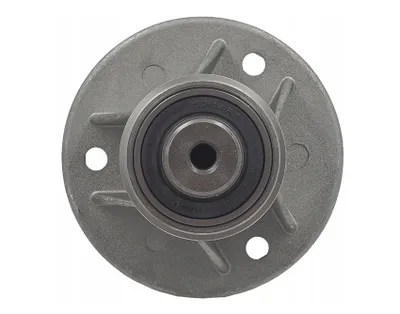 A close-up, top-down view of a lawnmower spindle hub with a bearing.