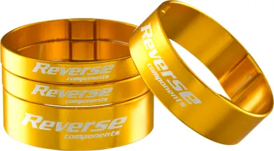 Produktbild von Reverse Alu Vorbau / SCS Spacer Set 1 1/8'' 2x 5mm 2x 10mm gold