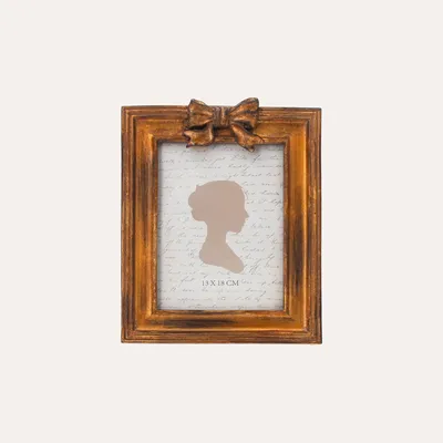 Produktbild von KEYHOMESTORE | Fotorahmen mit goldenem Schleifenmotiv (22 x 16 cm)