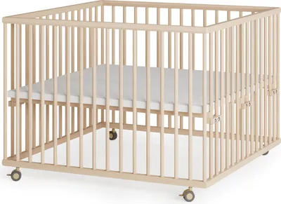 A wooden playpen with a mattress inside, shown from a slightly elevated angle.