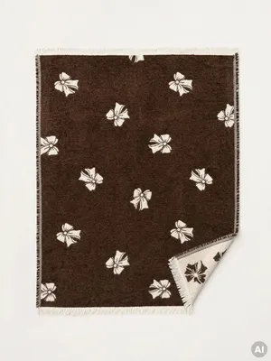 Zdjęcie produktu dla HOMLA Koc JOYLLE czekoladowy z kokardkami 130x170 cm