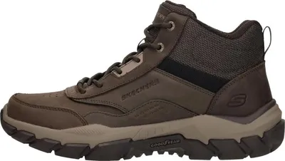 A side view of a brown Skechers boot.