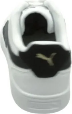 The back view of a white Puma sneaker with black accents and a gold Puma logo.