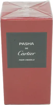 A close-up of a red perfume box with a dark gray label.