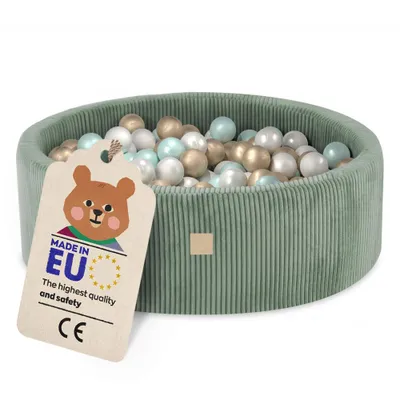 A green corduroy ball pit filled with colorful balls, with a tag attached.