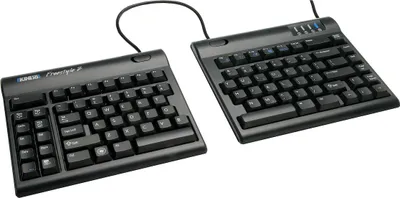 A split keyboard with a numeric keypad on the left half, connected by a cable to the right half.