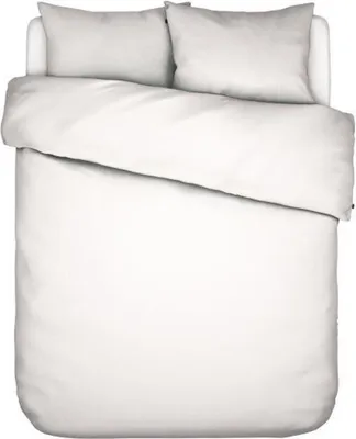 A top-down view of a white duvet and two white pillows on a white bed.
