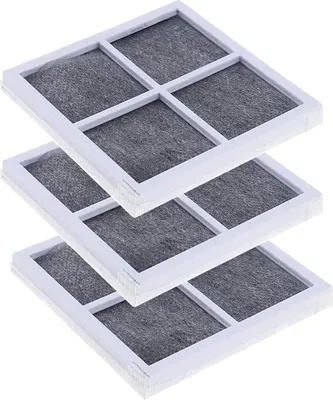 A stack of three square air filters with white frames and gray filter material.