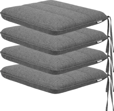 A stack of four grey seat cushions.