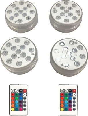 Four submersible LED lights and two remote controls are displayed against a white background.