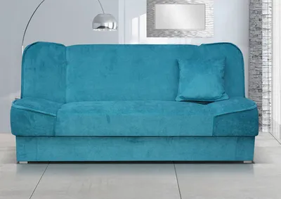 A teal sofa is shown in a well-lit room with a modern aesthetic.
