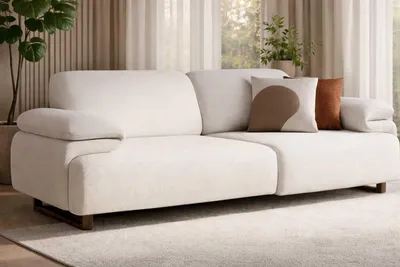Immagine prodotto di Divano imbottito beige, design moderno, ideale per il soggiorno, rivestito in tessuto
