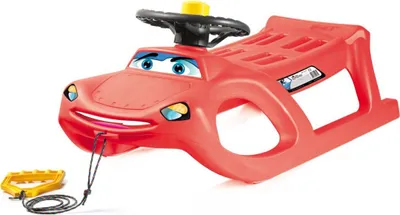A red plastic children's sled shaped like a cartoon car, with a steering wheel and a tow rope with a handle.